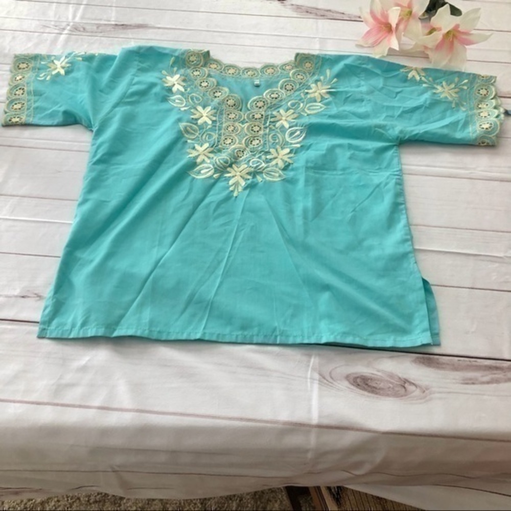 - Size MED/Large Turquoise top.